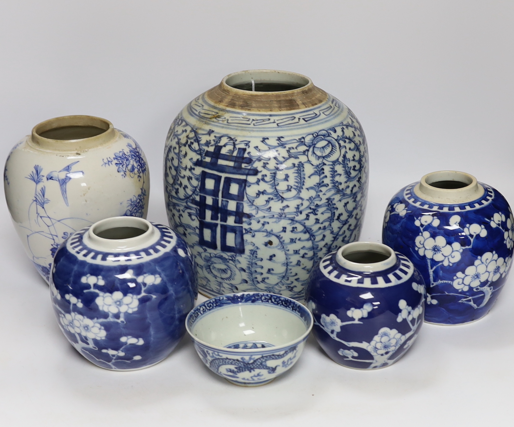 A group of four Chinese blue and white jars and a bowl, together with a similar Japanese jar, tallest 21cm